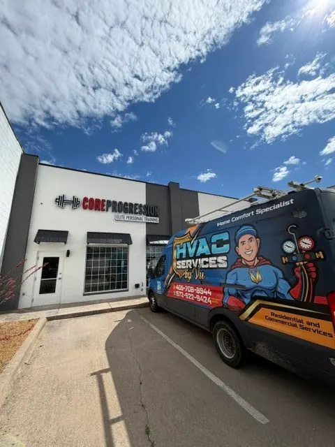 HVAC Services by Vu van parked at Core Progression Elite Personal Training under a blue sky